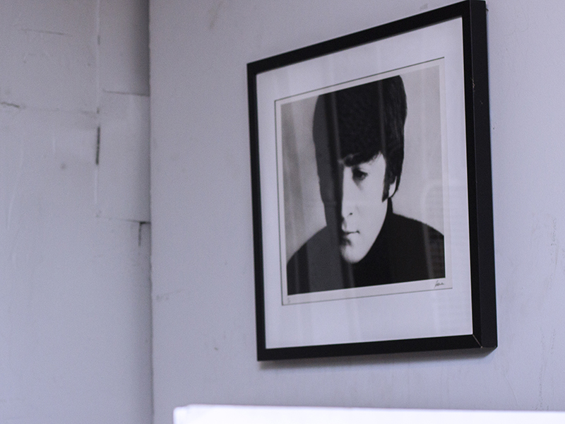 Photograph of John Lennon on the wall in the storage room of the SFAE