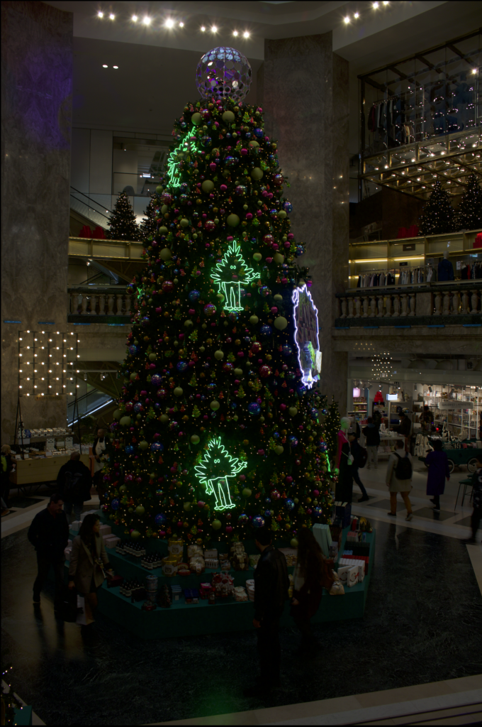 Christmas tree in the middle of a busy mall